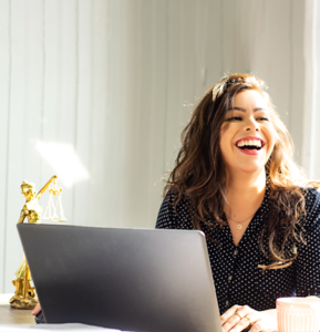 Female lawyer works at laptop