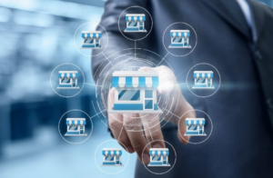 Person wearing a suit, pointing their index finger toward an image that represents franchise marketing.