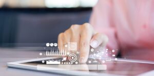 Close up businesswoman hand touch screen on digital tablet to use marketing tool and check traffic research of paid search.